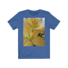 Load image into Gallery viewer, Close up photograph of two yellow lily's printed onto a true royal blue T-Shirt.