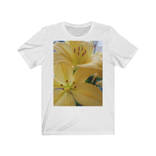 Load image into Gallery viewer, Close up photograph of two yellow lily's printed onto a white T-Shirt.

